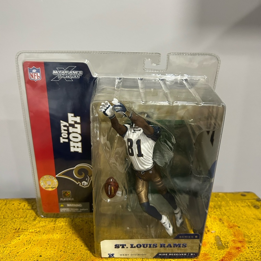 Torry Holt figure. Original packaging.
